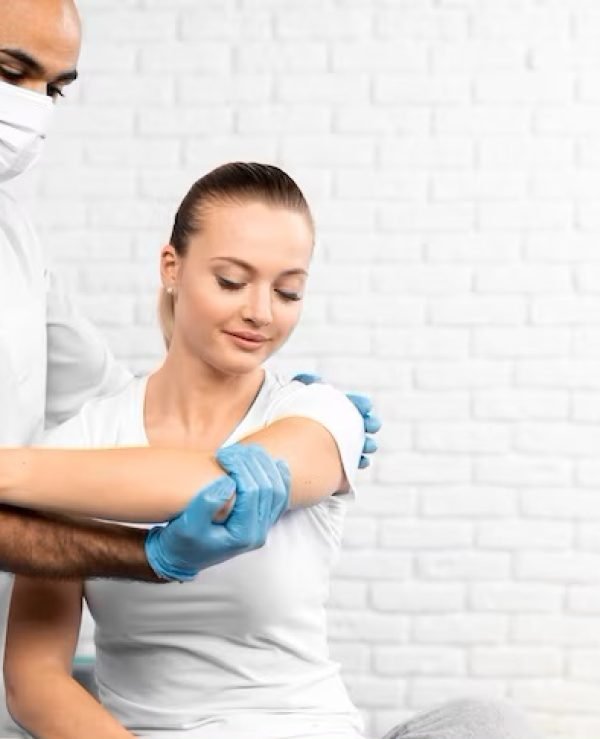 Physiotherapist coaching a patient through a guided strengthening exercise
