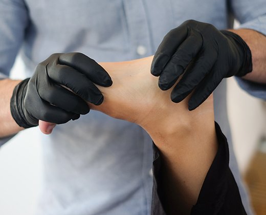 Physiotherapist treating a patient after a car accident at our Abbotsford clinic