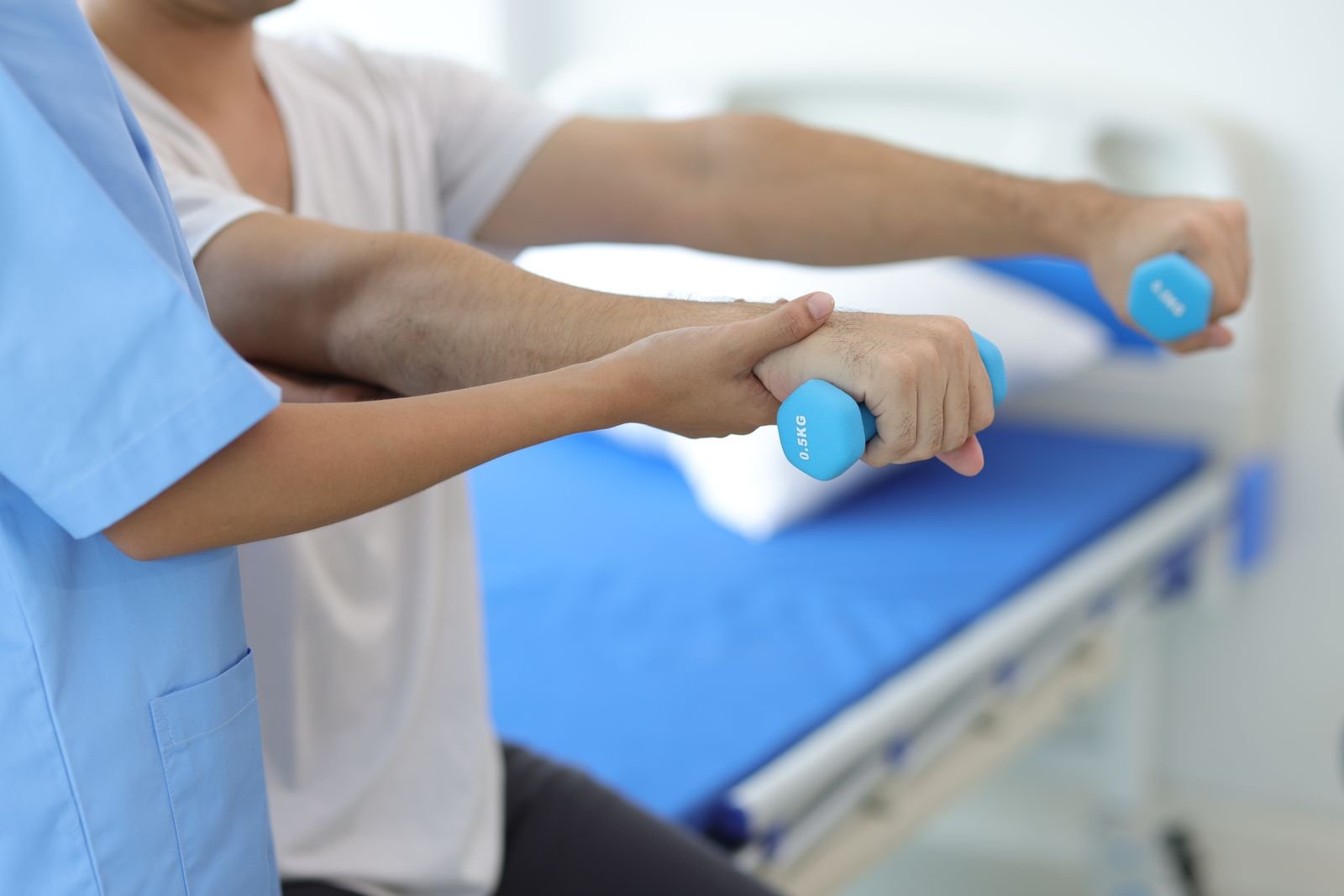 Physiotherapist assessing a patient's movement at the New Ray clinic in Abbotsford