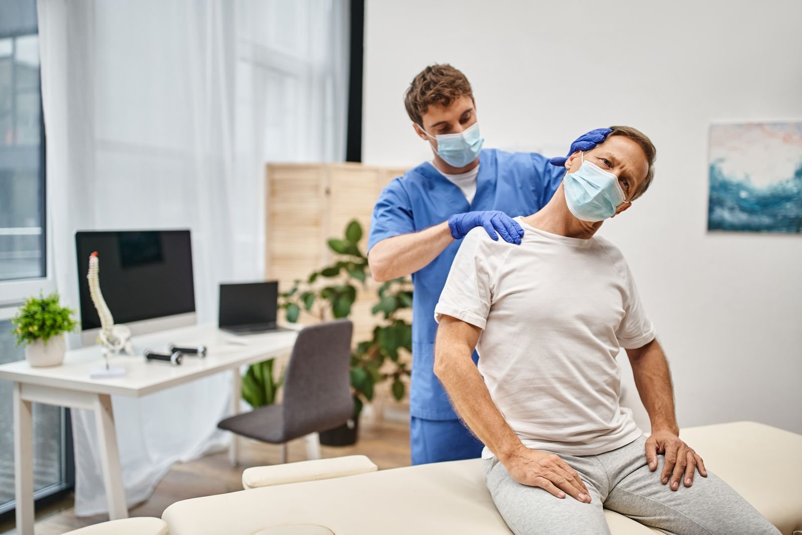 Physiotherapist guiding a patient through a resistance exercise at the Abbotsford clinic