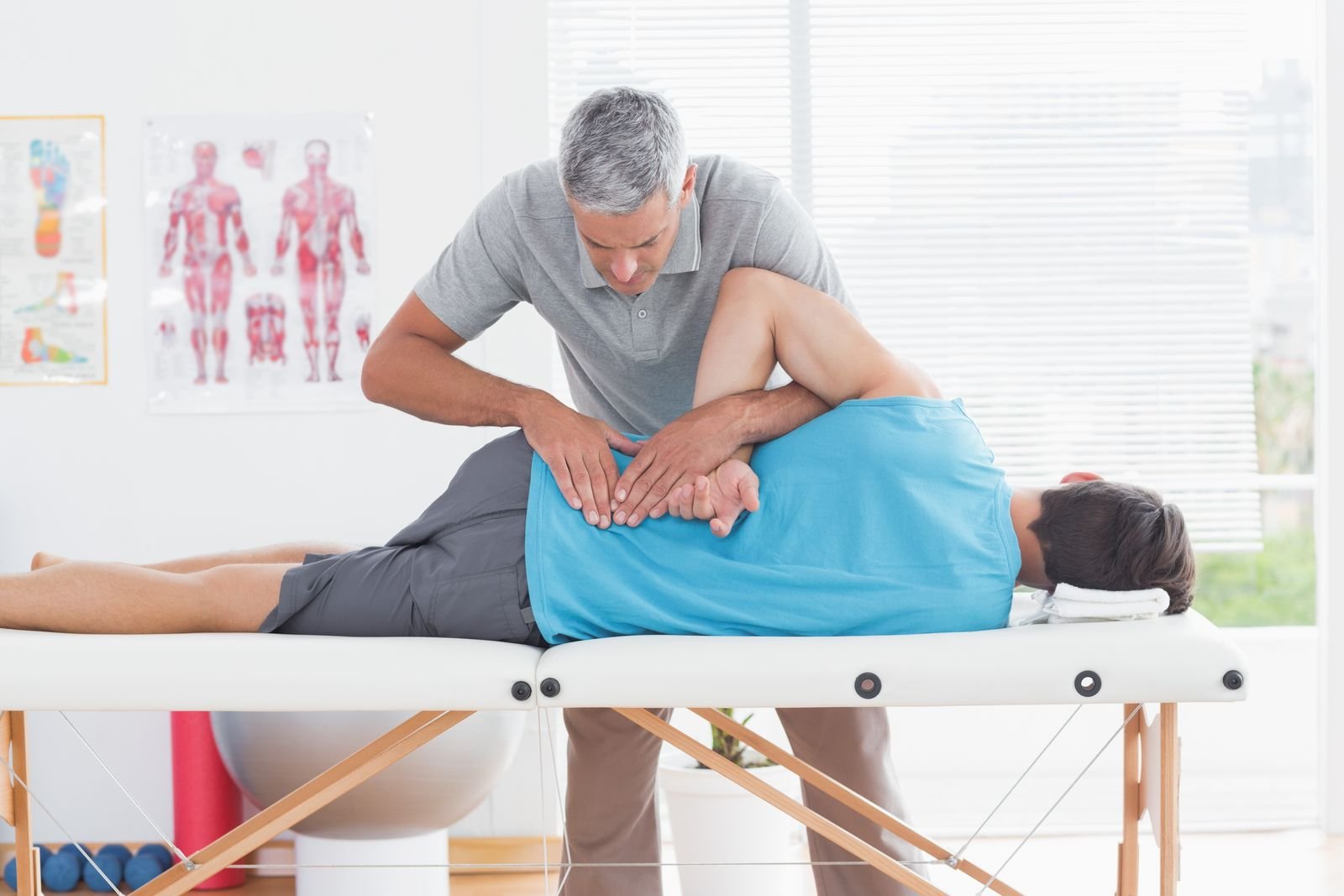 Massage therapist treating a patient's leg