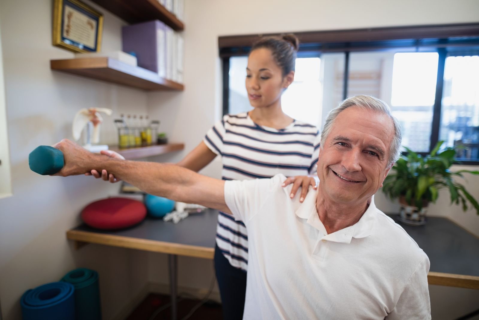 Physiotherapist in Abbotsford working one-on-one with a senior patient during a rehabilitation session