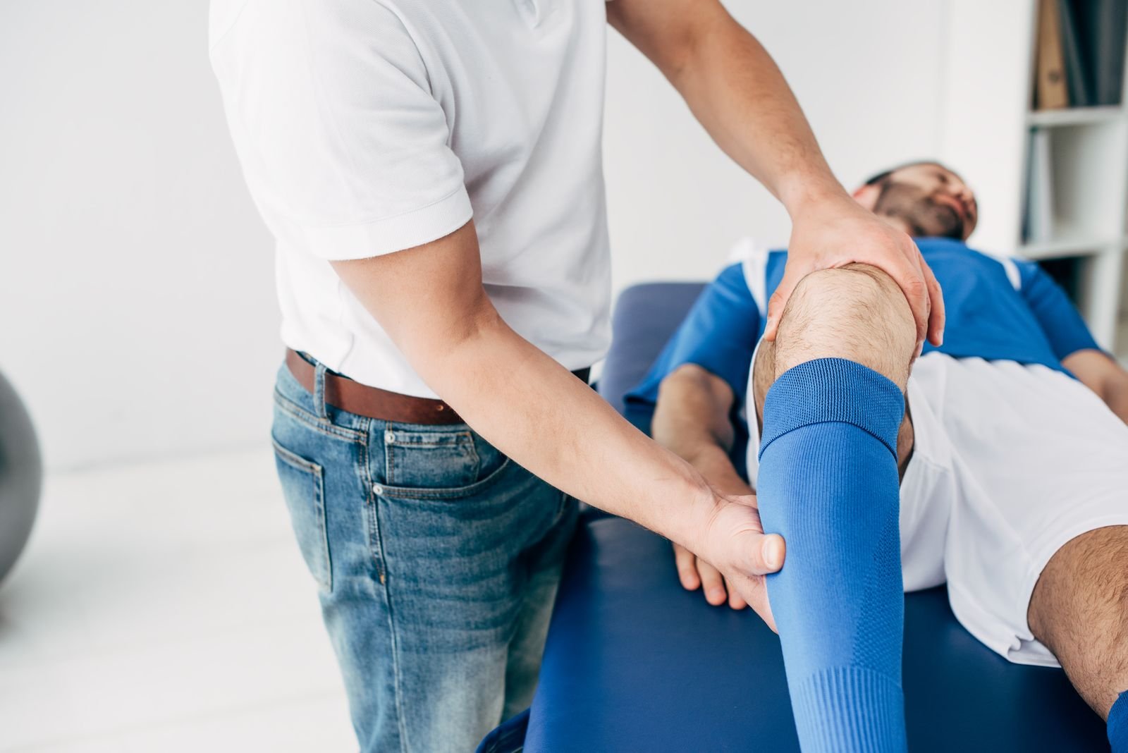 Physiotherapist assessing a patient's shoulder range of motion at New Ray Physiotherapy and Health Clinic in Abbotsford